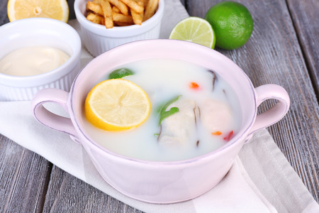 Tasty soup with oysters on wooden tableの写真素材