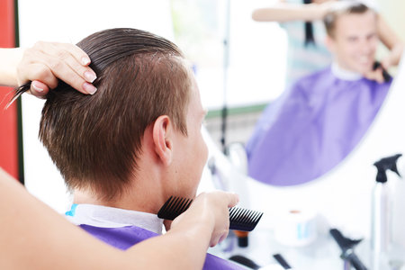 Young man in beauty salonの写真素材