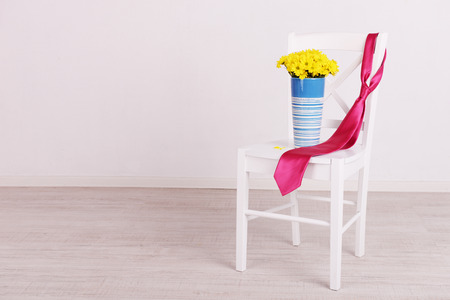 Bouquet of flowers and tie on Fathers Day in roomの写真素材