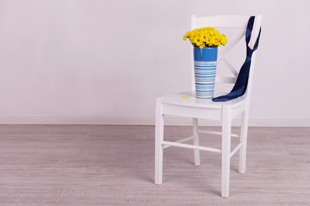 Bouquet of flowers and tie on Fathers Day in roomの写真素材