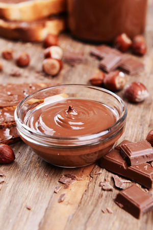 Sweet chocolate cream in bowl on table close-upの写真素材