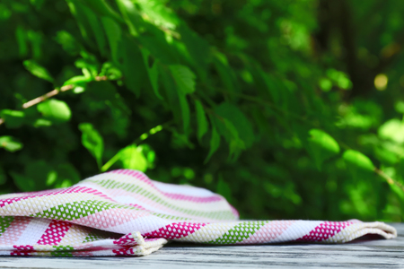 Wooden table with tablecloth, outdoorsの写真素材