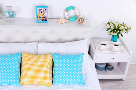 Comfortable soft bed in roomの写真素材