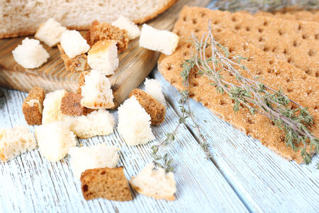 Homemade croutons on table in kitchen, close up