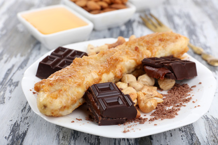Sweetened fried banana on plate, close-upの写真素材