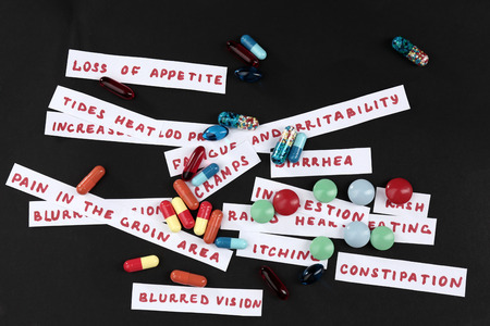 Prescription drug lottery on black background, close-upの写真素材