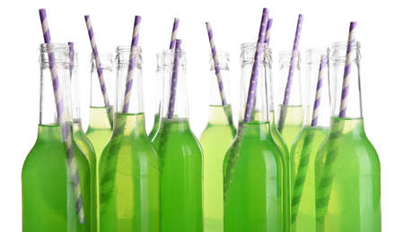 Bottles of drink with straw isolated on whiteの写真素材