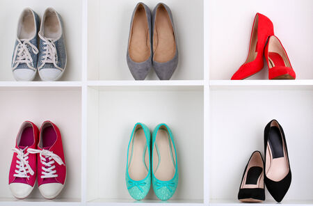Beautiful female shoes on wooden shelfの写真素材