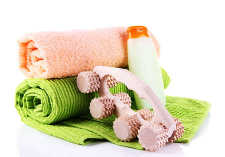 Wooden roller brush, towels and shampoo on white background isolatedの写真素材