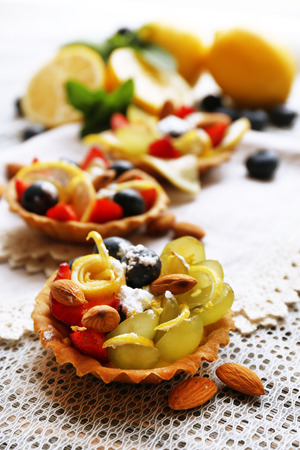 Tasty lemon desserts on table at homeの写真素材