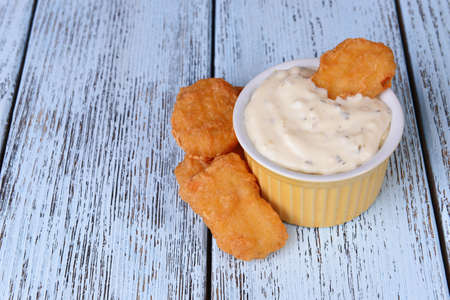 Chicken nuggets with sauce on table close-upの写真素材