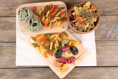 Colorful pasta on wooden backgroundの写真素材