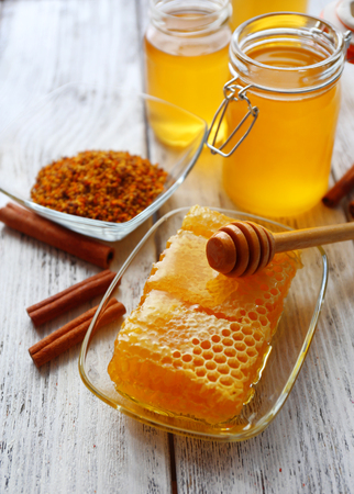 Fresh honey on wooden tableの写真素材