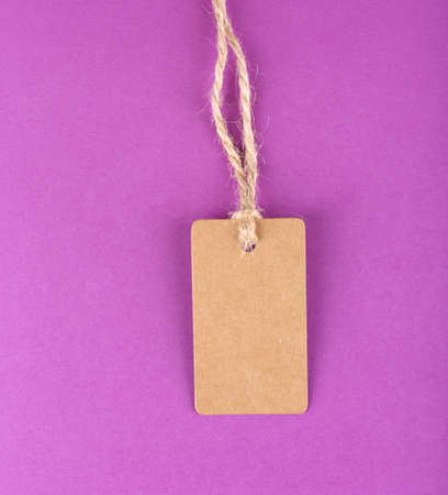 Brown tag on colorful backgroundの写真素材