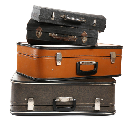 Vintage old travel suitcases, isolated on whiteの写真素材