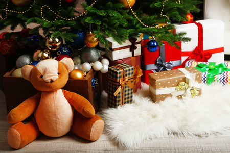 Lots of Christmas gifts on floor in festive interiorの写真素材