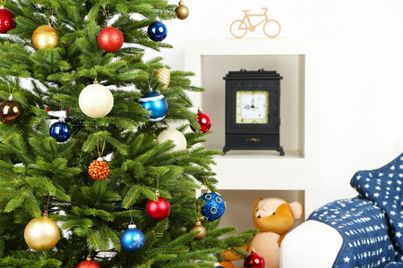 Decorated Christmas tree on home interior backgroundの写真素材