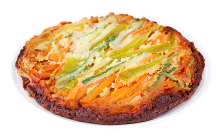 Casserole with vegetables on plate isolated on whiteの写真素材