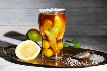 tasty summer drink with fresh fruits, on wooden table
