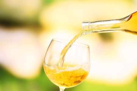 Wine pouring into wine glass, close-upの写真素材