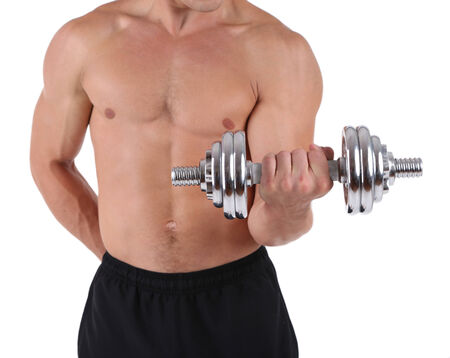 Young muscular sportsman execute exercise with dumbbell isolated on whiteの写真素材