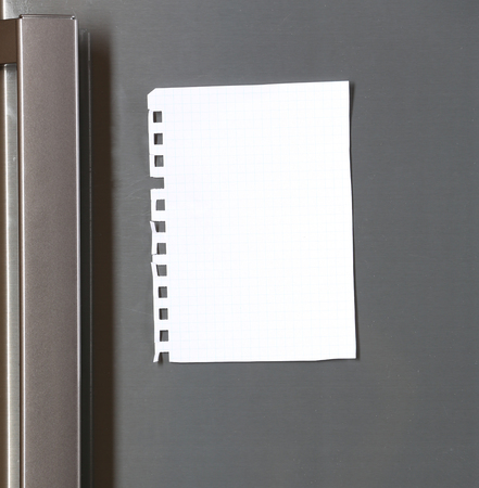Note on piece of paper on refrigerator closeupの写真素材