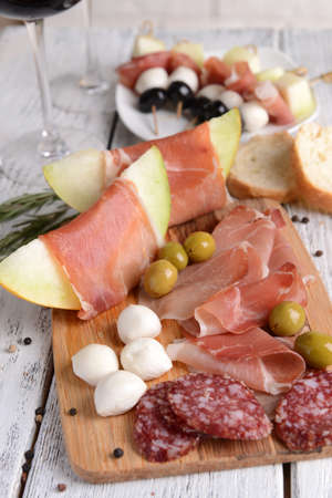 Delicious melon with prosciutto on table close-upの写真素材