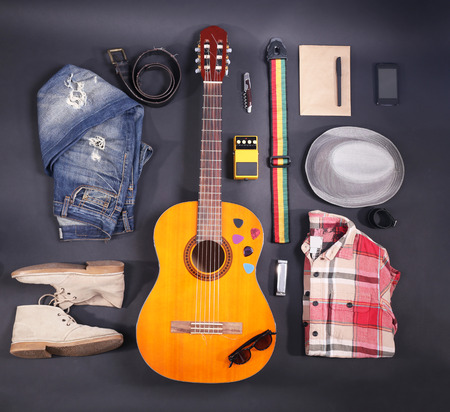 Music equipment, clothes and footwear on black backgroundの写真素材