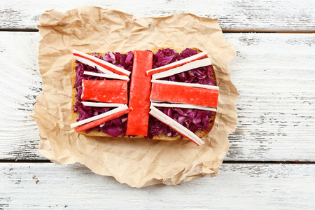 Sandwich with flag of Great Britain on table close-upの写真素材