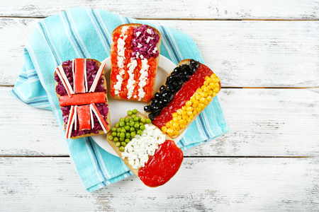 Sandwiches with  different flags on table close-upの写真素材