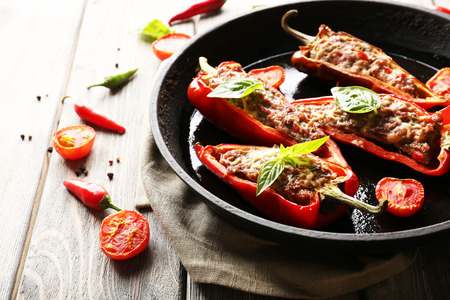 Delicious stuffed peppers in frying pan on table close-upの写真素材