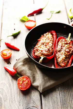 Delicious stuffed peppers in frying pan on table close-upの写真素材