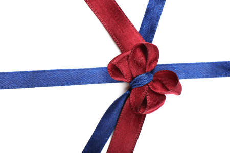 Dark blue and dark red ribbon and bow isolated on whiteの写真素材