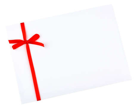 White envelope and red ribbon isolated on whiteの写真素材