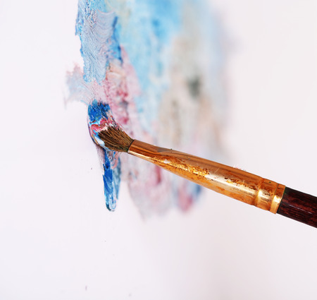 Artist paints picture close-upの写真素材