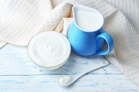 Dairy products on wooden table の写真素材
