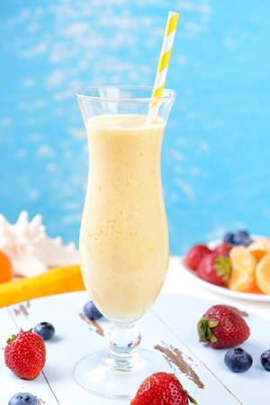 Delicious berry cocktail on table on water backgroundの写真素材