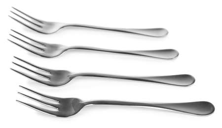 Metal small dessert forks isolated on white