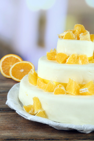 Beautiful wedding cake with oranges on  light backgroundの写真素材