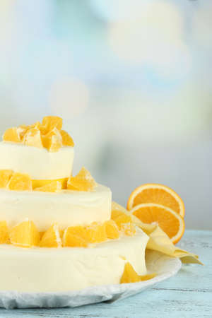 Beautiful wedding cake with oranges on  light backgroundの写真素材