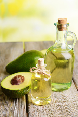 Avocado oil on table on light backgroundの写真素材