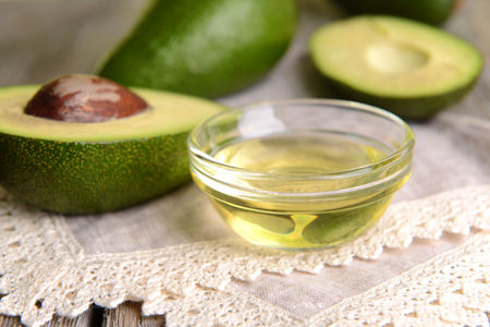 Avocado oil on table close-upの写真素材