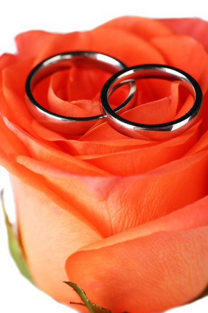 Wedding rings on wedding bouquet, close-up, on light backgroundの写真素材