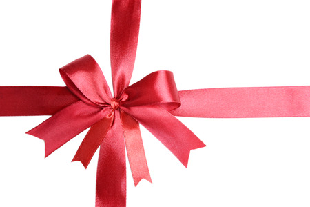 Shiny red ribbon with bow isolated on white