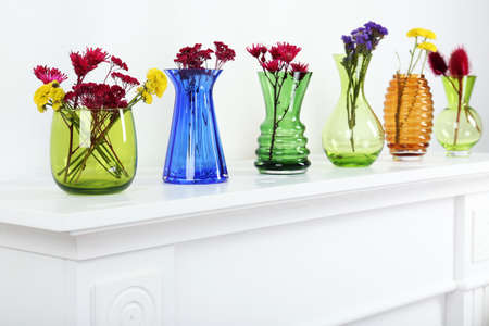 Colorful vases on white table, close-upの写真素材