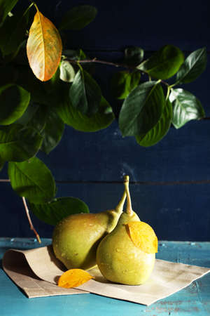 Ripe tasty pears on wooden tableの写真素材