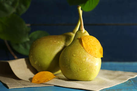 Ripe tasty pears on wooden tableの写真素材