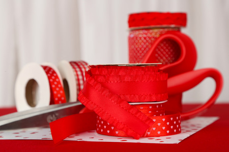 Ribbons with scissors on light backgroundの写真素材