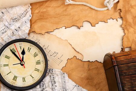Frame of old paper with vintage accessories on wooden background