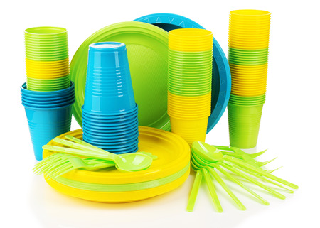 Bright plastic disposable tableware isolated on whiteの写真素材